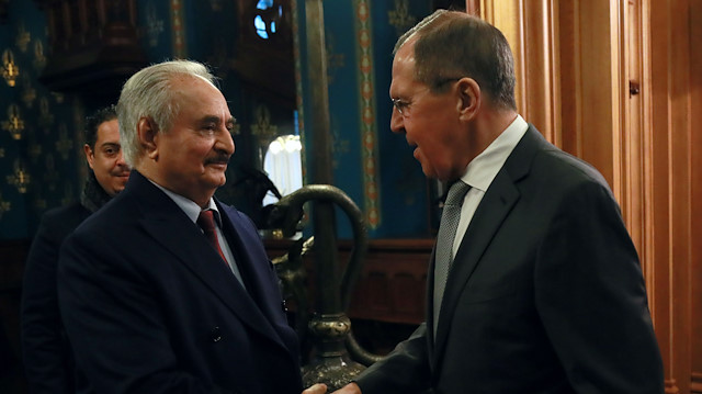 Khalifa Haftar shakes hands with Russian Foreign Minister Sergei Lavrov before talks in Moscow, Russia January 13, 2020. 

