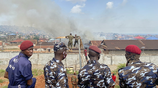 Police officers stand in front of the Male Correctional center after riot erupted at a prison amid the spread of the coronavirus disease (COVID-19) in Freetown, Sierra Leone April 29, 2020