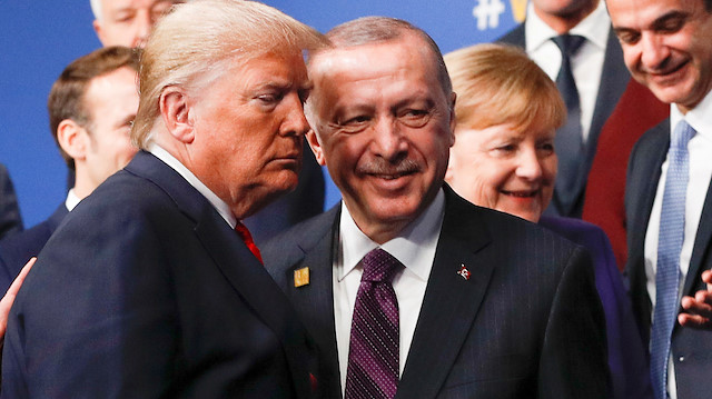 FILE PHOTO: U.S. President Donald Trump and Turkey's President Recep Tayyip Erdogan leave the stage after family photo during the annual NATO heads of government summit at the Grove Hotel in Watford, Britain December 4, 2019. REUTERS/Peter Nicholls/Pool/File Photo

