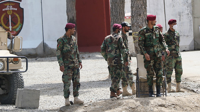 File photo: Afghan police officers are seen at a scene of a suicide bomb attack