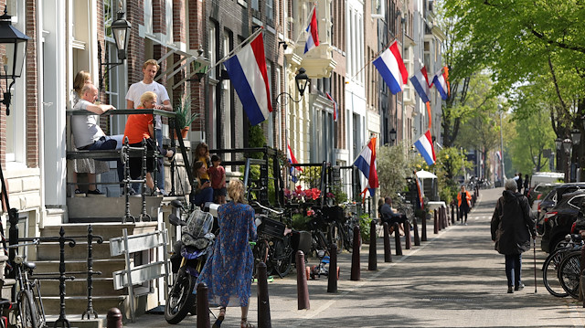 Dutch flags hang outside apartments to celebrate King's Day (Koningsdag)