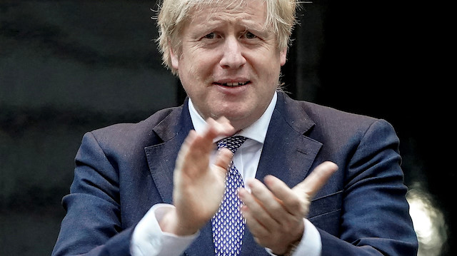 Britain's Prime Minister Boris Johnson takes part in a 'Clap for Carers' campaign in support of the NHS, following the outbreak of the coronavirus disease (COVID-19), at 10 Downing Street in London, Britain April 30, 2020. Pippa Fowles/No 10 Downing Street