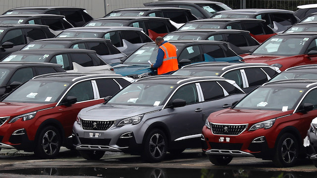 File photo: A worker checks cars at the PSA Peugeot Citroen plant in Poissy, near Paris, October 31, 2019.