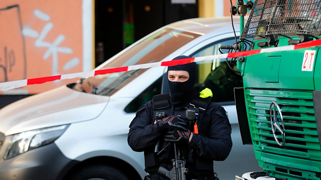 German special police guards the entrance of the El-Irschad centre in Berlin, Germany