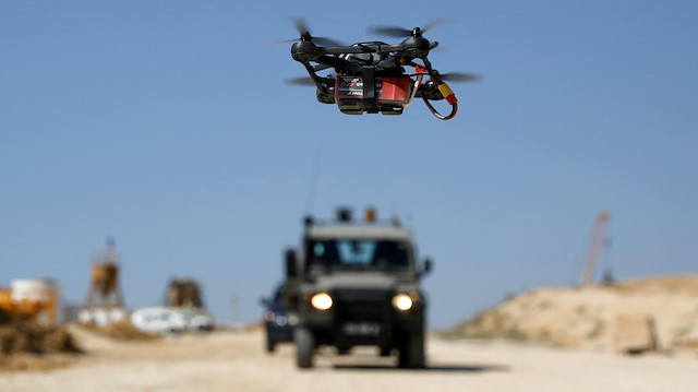 A drone flown by Israeli soldiers trying to intercept Palestinian kites and balloons loaded with flammable materials, is pictured in an area where such devices have caused blazes on the Israeli side of the border between Israel and the Gaza Strip, near Kissufim, Israel June 5, 2018. REUTERS/Amir Cohen

