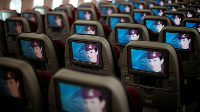 FILE PHOTO: Seats and screens are seen in the economy class cabin of Qatar Airways new Boeing 787 Dreamliner are seen after it arrived on it's inaugural flight to Heathrow Airport, west London December 13, 2012. REUTERS/Andrew Winning/File Photo  