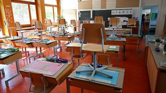 Chairs are put on desks in a class room at Tour primary school before its reopening on Monday, following the coronavirus disease (COVID-19) outbreak, at Grand-Saconnex in Geneva, Switzerland, May 8, 2020. REUTERS/Denis Balibouse

