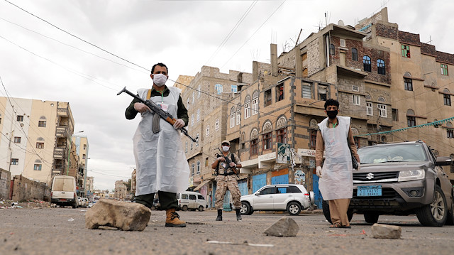 File photo: Security men wearing protective masks stand on a street during a 24-hour curfew amid concerns about the spread of the coronavirus disease (COVID-19), in Sanaa, Yemen May 6, 2020