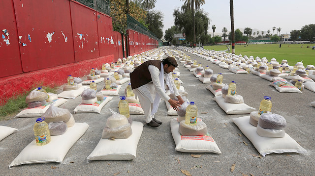 File photo: A man prepares free food donated by the Afghan government, amid the spread of the coronavirus disease (COVID-19), in Jalalabad, Afghanistan April 28, 2020