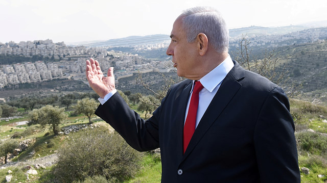  Israeli Prime Minister Benjamin Netanyahu delivers a statement overlooking the Israeli settlement of Har Homa, located in an area of the Israeli-occupied West Bank on February 20, 2020.