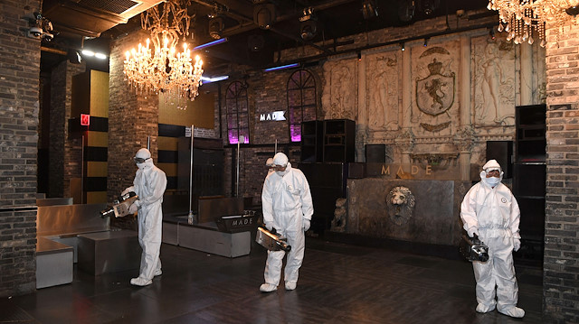 Quarantine worker spray disinfectants at a night club on the night spots in the Itaewon neighborhood, following the coronavirus disease (COVID-19) outbreak, in Seoul, South Korea, May 12, 2020.