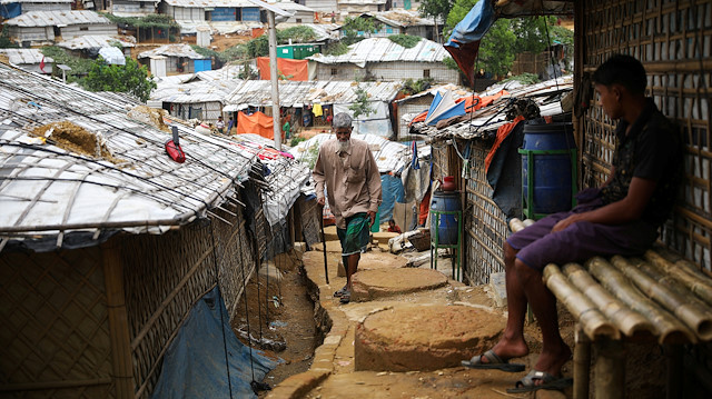 FILE PHOTO: A Rohingya refugee walks at a refugee camp in Cox's Bazar, Bangladesh, March 7, 2019. 