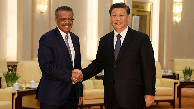 Tedros Adhanom, director general of the World Health Organization, shakes hands with Chinese President Xi jinping before a meeting at the Great Hall of the People in Beijing, China

