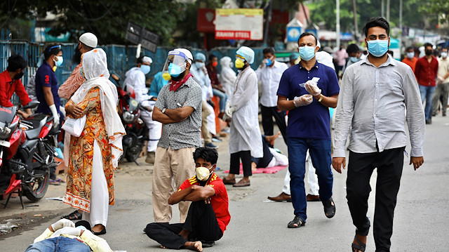 People wait in the queue outside of a coronavirus testing center amid concerns over coronavirus disease (COVID-19) outbreak in Dhaka, Bangladesh, May 17, 2020
