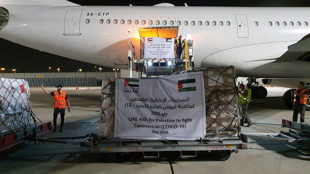 A cargo plane operated by Etihad Airways offloads aid related to the coronavirus 