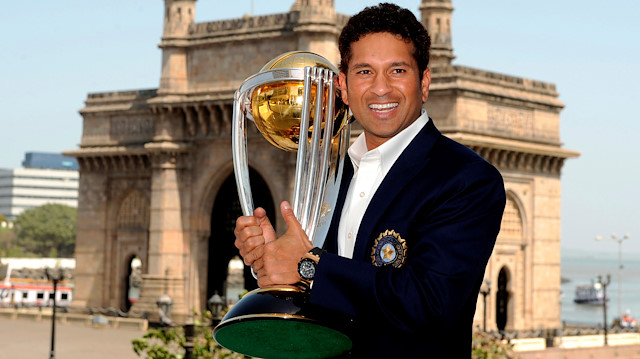 FILE PHOTO: India's Sachin Tendulkar holds the trophy at the Taj hotel, the day after India defeated Sri Lanka in the ICC Cricket World Cup final, in Mumbai April 3, 2011. REUTERS/Philip Brown/File Photo

