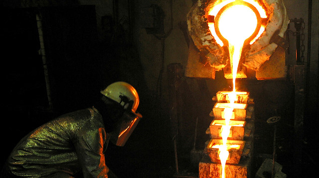 FILE PHOTO: A worker pours gold at the AngloGold Ashanti mine at Obuasi, Ghana, October 23, 2003. 