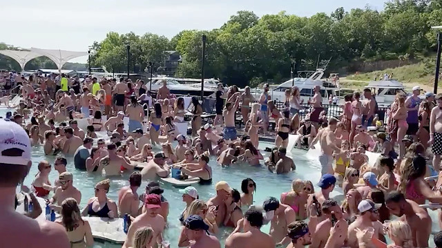 Revelers celebrate Memorial Day weekend at Osage Beach of the Lake of the Ozarks, Missouri, U.S., May 23, 2020 in this screen grab taken from social media video and obtained by Reuters on May 24, 2020. Twitter/Lawler50/
