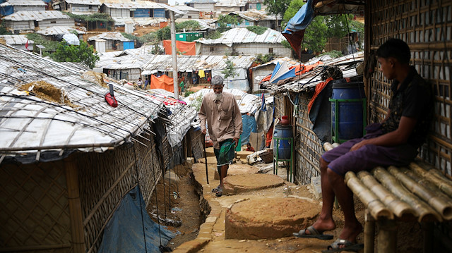 FILE PHOTO: A Rohingya refugee walks at a refugee camp in Cox's Bazar, Bangladesh, March 7, 2019