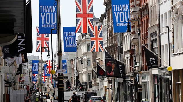 Union Jack and "Thank you" flags are seen on Bond Street in London