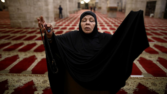 A worshipper prays inside al-Aqsa mosque as it reopened to worshippers after a two-and-a-half month coronavirus closure, on the compound known to Muslims as the Noble Sanctuary and to Jews as the Temple Mount in Jerusalem's Old City May 31, 2020. REUTERS/Ammar Awad

