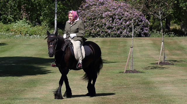 Britain's Queen Elizabeth II rides Balmoral Fern, a 14-year-old Fell pony, in Windsor Home Park, following the outbreak of the coronavirus disease (COVID-19), in Windsor, Britain, in this undated pool picture released on May 31, 2020