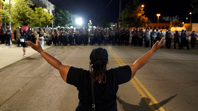 Police officers advance towards a protester during nationwide unrest following the death in Minneapolis police custody of George Floyd in Oklahoma City, Oklahoma, U.S., May 31, 2020 