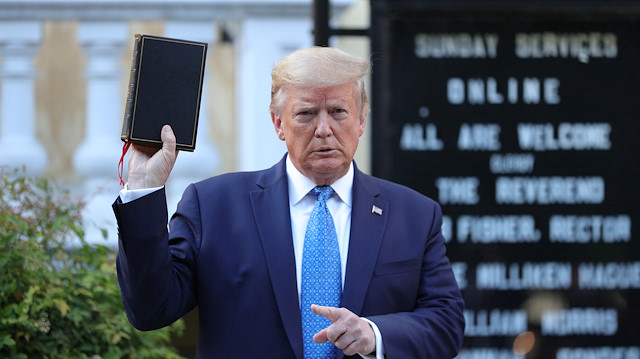 U.S. President Donald Trump holds up a Bible as he stands in front of St. John's Episcopal Church across from the White House after walking there for a photo opportunity during ongoing protests over racial inequality in the wake of the death of George Floyd while in Minneapolis police custody, at the White House in Washington, U.S., June 1, 2020.