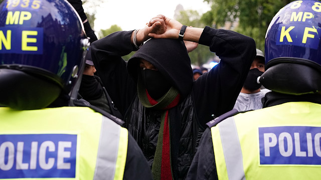Police officers are seen with demonstrators on Whitehall during a Black Lives Matter protest in London, following the death of George Floyd who died in police custody in Minneapolis, London, Britain, June 6, 2020