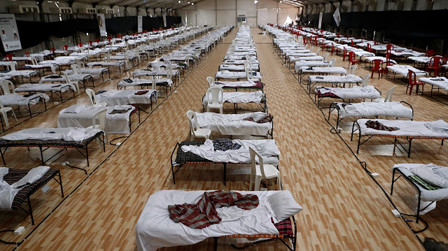 Beds are seen inside a recently constructed makeshift hospital and quarantine facility