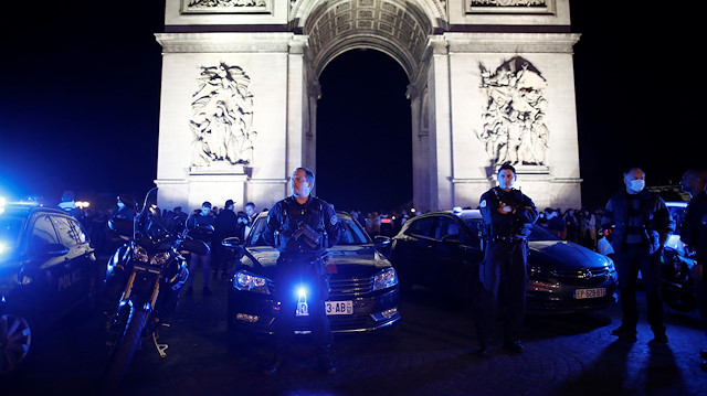Police officers attend a demonstration against French Interior Minister Christophe Castaner's reforms, including ditching a controversial chokehold method of arrest, following the death in Minneapolis police custody of George Floyd, near Arc de Triomphe in Paris, France, June 14, 2020.