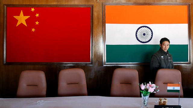 FILE PHOTO: A man walks inside a conference room used for meetings between military commanders of China and India, at the Indian side of the Indo-China border at Bumla, in the northeastern Indian state of Arunachal Pradesh, November 11, 2009. 