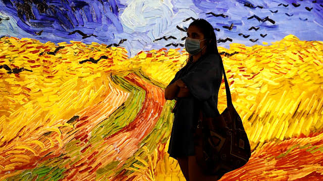 A visitor wearing a face mask attends the "Meet Vicent Van Gogh" exhibition, as the spread of the coronavirus disease (COVID-19) continues, in Lisbon, Portugal, May 29, 2020. REUTERS/Rafael Marchante

