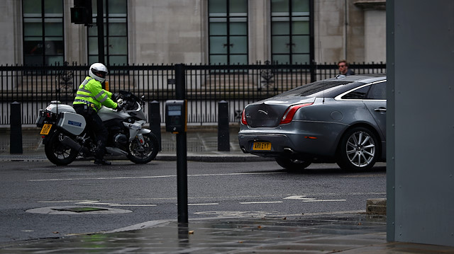 File photo: The dented car carrying Britain's Prime Minister Boris Johnson leaves the Houses of Parliament