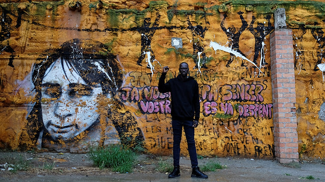 African immigrant Serigne Mamadou, 41, an activist and fruit picker, poses near the place where his compatriots (not pictured) live on the streets while waiting for available fruit picking jobs, in Lleida, Spain, June 16, 2020. Picture taken June 16, 2020. REUTERS/Nacho Doce

