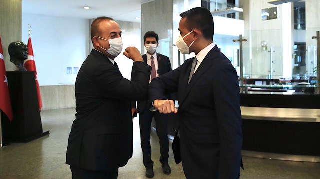 Turkish Foreign Minister Mevlut Cavusoglu and his Italian counterpart Luigi Di Maio greet each other in Ankara, Turkey June 19, 2020.