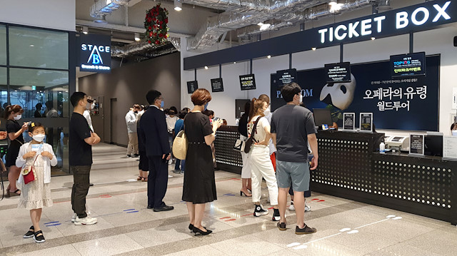 People wait in a line to get ticket for Phantom of the Opera as the spread of the coronavirus disease (COVID-19) continues, at a theatre in Seoul, South Korea, June 18, 2020. Picture taken June 18, 2020. REUTERS/Daewoung Kim

