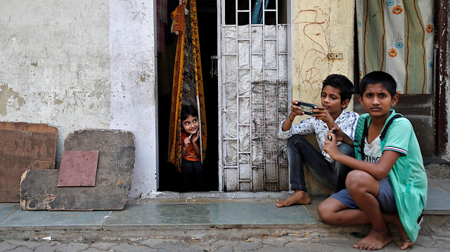 File photo: Children play outside a house, during a nationwide lockdown in India to slow the spread of COVID-19, in Dharavi, one of Asia's largest slums, during the coronavirus disease outbreak, in Mumbai, India, April 10, 2020