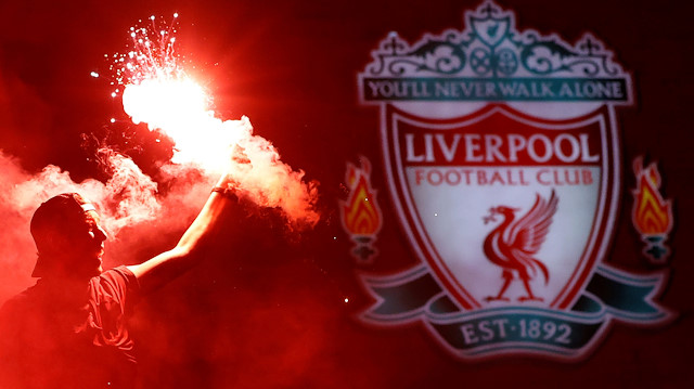 Soccer Football - Premier League - Liverpool fans celebrate winning the Premier League - Liverpool, Britain - June 25, 2020 Liverpool fans celebrate winning the Premier League with flares outside Anfield after Chelsea won their match against Manchester City