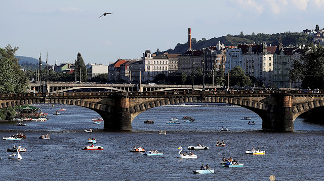 FILE PHOTO: People ride pedal boats on the Vltava river following the coronavirus disease (COVID-19) outbreak, in Prague, Czech Republic, June 22, 2020. 