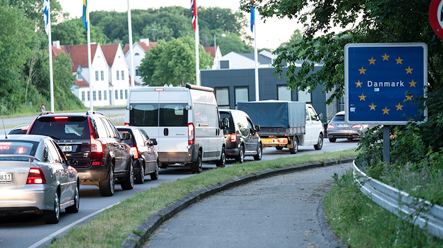 File photo: Cars queue at a border crossing, after Denmark opened its borders to Germany following lockdowns related to the coronavirus disease (COVID-19), in Krusaa, Denmark June 15, 2020
