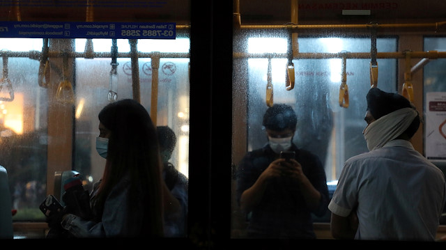 People wearing protective masks travel on a public bus amid the coronavirus disease (COVID-19) outbreak in Kuala Lumpur, Malaysia, June 26, 2020. REUTERS/Lim Huey Teng

