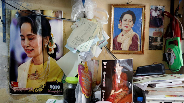 FILE PHOTO: Photographs of Myanmar State Counselor Aung San Suu Kyi hung in a shop in Yangon, Myanmar, January 23, 2020. REUTERS/Ann Wang/File Photo

