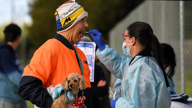 A medical professional administers a test to a member of the public at a pop-up coronavirus disease (COVID-19) testing facility, as the state of Victoria experiences a spike in cases, in Melbourne, Australia, June 26, 2020. AAP Image/James Ross via REUTERS