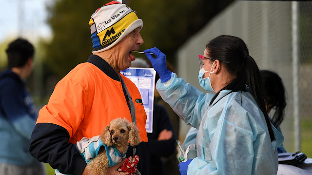 A medical professional administers a test to a member of the public at a pop-up coronavirus disease (COVID-19) testing facility, as the state of Victoria experiences a spike in cases, in Melbourne, Australia, June 26, 2020. AAP Image/James Ross via REUTERS 