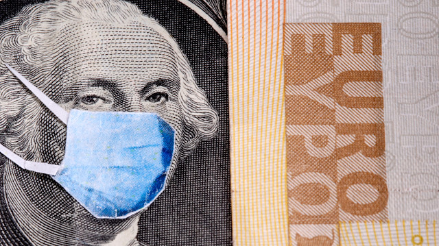 George Washington is seen with printed medical masks on the one Dollar near Euro banknote in this illustration taken, March 31, 2020. REUTERS/Dado Ruvic/Illustration