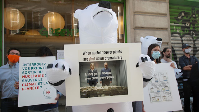 Members of the group "The Voices of Nuclear" demonstrate in reaction to the closure of the Fessenheim nuclear power plant in front of Greenpeace headquarters in Paris, France June 29, 2020. REUTER/Charles Platiau

