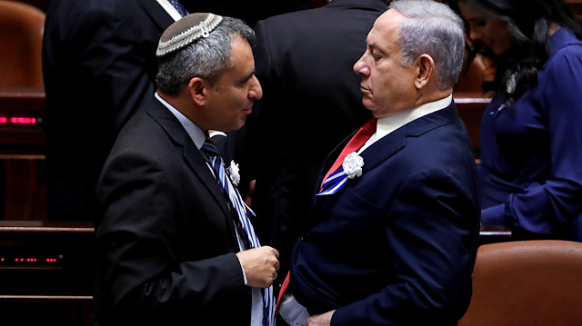 FILE PHOTO: Israeli Prime Minister Benjamin Netanyahu speaks with member of the Knesset for Likud Zeev Elkin as they attend the swearing-in ceremony of the 22nd Knesset, the Israeli parliament, in Jerusalem October 3, 2019. REUTERS/Ronen Zvulun/File Photo

