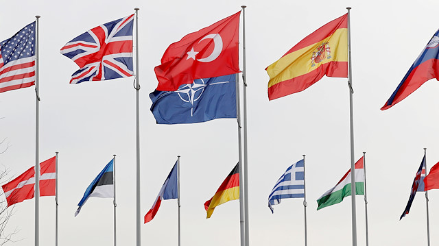 Flags of NATO member countries flutter at the Alliance headquarters in Brussels, Belgium, February 28, 2020.