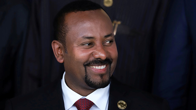 FILE PHOTO: Ethiopian Prime Minister Abiy Ahmed smiles during an African Union (AU) summit meeting in Addis Ababa, Ethiopia, February 9, 2020. REUTERS/Tiksa Negeri - RC22XE930YBN/File Photo

